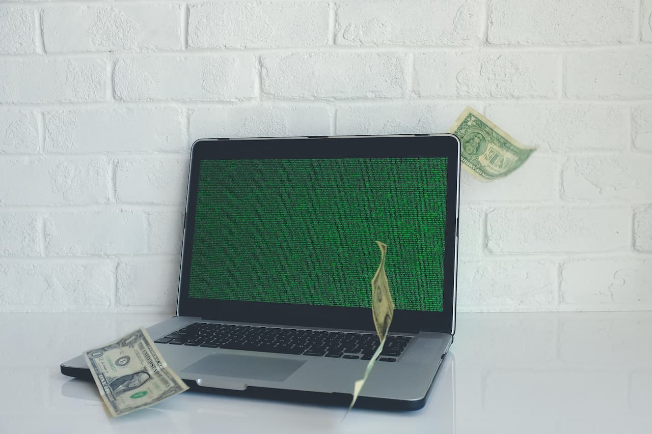 Money floating around laptop